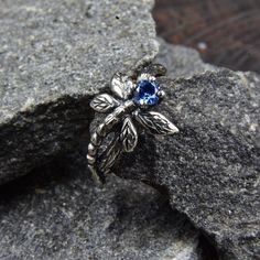 This unique silver engagement ring features a beautiful sapphire stone and delicate dragonfly on an intricately designed twig band. Handcrafted with care, the ring has an antique look thanks to its oxidation coating. It's perfect for nature lovers.  Characteristics: Metal - Recycled solid sterling silver  Stone - Cubic Zirconia Finish - Oxidized. View all silver gothic rings: https://www.etsy.com/shop/TinyShinyJewel?ref=seller-platform-mcnav&section_id=42765371 Care instructions: To care for the ring, avoid contact with water and chemicals such as perfumes and lotions. When the ring is not in use, store it in a dry, cool place to prevent tarnishing. Additional information:  ✦ All rings are made to order. An average turnaround time is 1-5 days. I will make every effort to ship the ring soon Alternative Bridal, Gothic Rings, Silver Engagement Rings, Sapphire Stone, Engagement Rings Sapphire, Bridal Rings, Custom Rings, Rings Statement, Silver Fashion