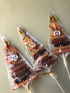 three bags filled with different types of meats and veggies on skewers