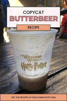 a harry potter cup sitting on top of a wooden table with the words, copycat butterbeeer recipe