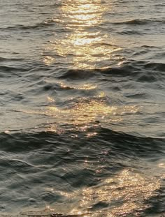 the sun shines brightly on the water as it reflects off the surface of the ocean