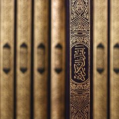 a close up of a book on a shelf with many books in the back ground