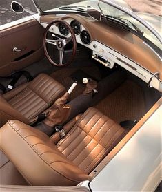 the interior of a car with brown leather seats