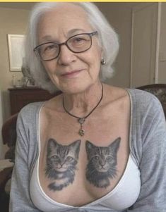 an older woman with two cats on her chest and the caption says, i am not