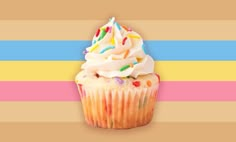 a cupcake with white frosting and sprinkles on a multicolored background