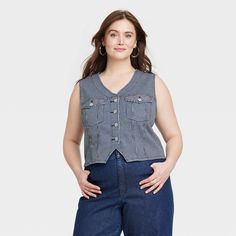 This Button-Front Denim Vest from Universal Thread™ will make a cool addition to your denim collection. Made from midweight cotton fabric with added stretch in a regular fit, it offers comfortable all-day wear. The flattering V-neckline, button-front design and chest flap pockets add touches of classic style. You can wear this sleeveless denim vest with high-waist pants, skirts and more for a variety of chic ensembles. Universal Thread™: Found exclusively at Target. Sleeveless Denim Vest, Womens Denim Vest, Pants Skirts, Target Clothes, Denim Collection, Hem Style, Waist Pants, Denim Vest, Front Design