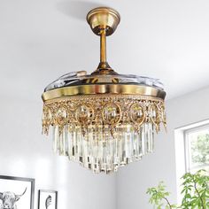 a chandelier hanging from the ceiling in a living room