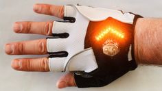 a man's hand with a light up glove on it, and the fingers are visible