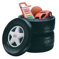 there is a toy car in the middle of two tires