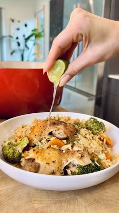 a person is cutting into some food in a bowl