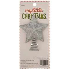 a silver star shaped christmas ornament on a white card with the words, my little christmas