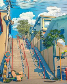 the stairs are painted blue and red to match the building's colors, while the sky is partly cloudy