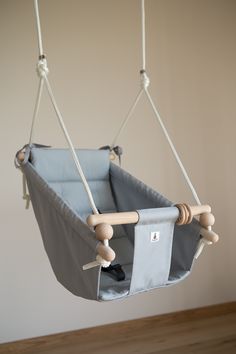 a baby's swing hanging from the ceiling