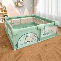 a child's playpen in the middle of a room with wooden floors and walls