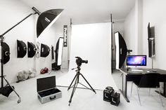 a photo studio is set up with lighting and equipment