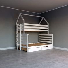 there is a bunk bed with two drawers in the middle and a ladder to the bottom