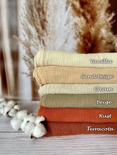 four towels stacked on top of each other with the names of different types and colors