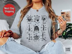 Delve into the fascinating world of anatomy with our Human Skeleton Anatomy Shirt. This vintage-inspired design celebrates the complexity of the human body's bones, making it an ideal gift for medical and nursing students or anyone intrigued by anatomy. With its timeless appeal and unisex fit, it's the perfect choice for those passionate about the study of the human form. ✨ K E Y * F E A T U R E S ✨ 👕 Snug fit with lively colors that stay vibrant even after multiple washes. 💫 Seamlessly side-s Anatomy Nursing, Shirt Anatomy, Human Body Bones, Medical Shirt, Human Skeleton Anatomy, Nursing Student Shirts, Anatomy Shirts, Body Bones, Skeleton Anatomy