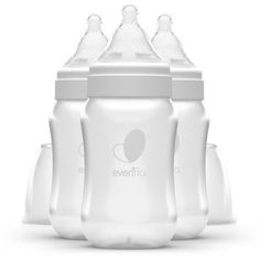 three baby bottles sitting next to each other