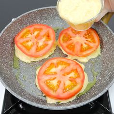 tomatoes are being cooked in a pan on the stove top with butter and sauce over them