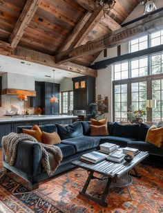 a living room filled with furniture and lots of windows