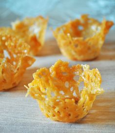 small pieces of food sitting on top of a wooden table