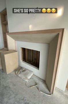 an unfinished fireplace in the middle of a room