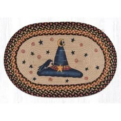 an oval rug with a witches hat on the bottom and stars in the middle,