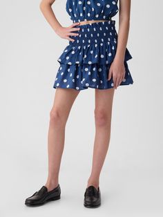 Soft cotton skort.  Smocked waist.  Tiered ruffle skirt.  Inner shorts.  Easy pull-on waist.  Easy through the hip and thigh. Spring Skirted Bottoms With Gathered Waist, Casual Tiered Skirt Bottoms With Gathered Waist, Casual Tiered Skirt With Gathered Waist, Spring Skirted Shorts With Elastic Waistband, Skirted Shorts With Ruffle Hem For Summer, Summer Skirted Shorts With Ruffle Hem, Playful Elastic Bottoms For Spring, Gap Summer Shorts With Elastic Waistband, Summer Skirted Bottoms With Smocked Back