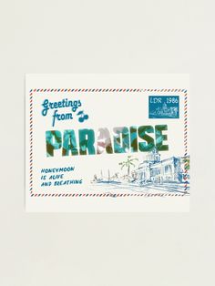 a postcard with the words greetings from paradise written in blue and green on it