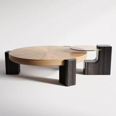 two wooden tables sitting next to each other on top of a white surface with black legs