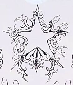 a drawing of a star surrounded by ornate designs