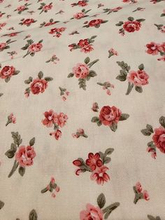 an image of a bed with red flowers on it