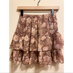 Light Brown, Ruffled Skirt With Pastel Floral Print. Elasticated, Very Stretchy Waist Two Ruffled Layers Fully Lined Never Worn, New With Tags Size Xxs Length: 17 In. Waist: Approx 13 In. Pink Mini Hem Skirt For Spring, Spring Pink Mini Skirt, Pink Tiered Bohemian Bottoms, Tiered Ruffled Mini Skirt In Pink, Fitted Tiered Mini Skirt In Pink, Tiered Pink Mini Skirt With Ruffles, Ruffled Skirt For Brunch, Flowy Ruffled Skirt For Brunch, Pink Fitted Tiered Mini Skirt