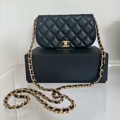 This Is An Authentic Chanel Clutch With Chain In Black Calfskin Leather With Gold Hardware. This Item Has A Faint Scratch (Please See Picture, Circled In Blue) But Otherwise, Is In Pristine Condition. It Measures 7.25"W X 4"H X 1.25"D With A 22” Chain Drop. It Comes With Authenticity Card, Dust Bag, And Box. I Respectfully Ask That You Do Not Submit A Lowball Offer. I Will Not Entertain Any Offers That Are Significantly Below My Asking Price. Thank You! Chanel 19 Wallet On Chain, Chanel Clutch With Chain 2022, Luxury Black Wallet On Chain With Gold-tone Hardware, Chanel Clutch, Chanel Clutch With Chain, Black Chanel Wallet, Gold Hardware, Chanel Bag, Calf Skin