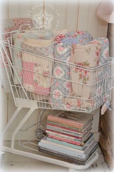 a white wire basket filled with lots of books