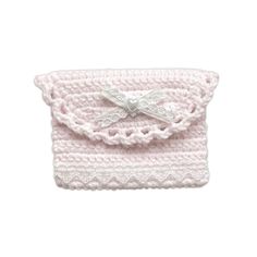 a pink crocheted purse with a bow on it