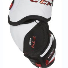 the back of a white and black hockey goalie's knee pads with red lettering