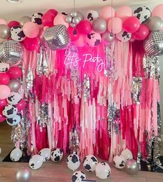 pink and silver party decorations with balloons, streamers and pandas on the wall