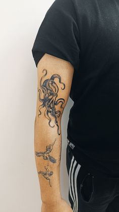 a man with a tattoo on his arm