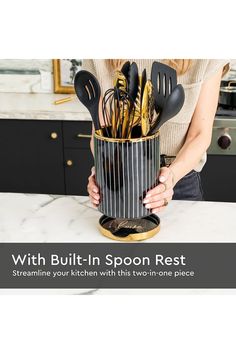 a woman holding a pot with utensils in it and the words, with built - in spoon rest