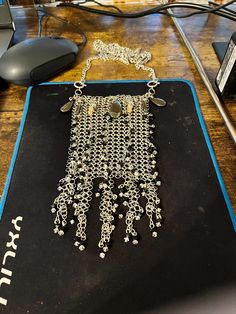 There are two of these. They are made to go together but are not exactly alike. They are meant to be worn as front/back or male/female and can be worn over clothing or intimately. They can also be worn as bib necklace. They can be purchased separately but are $350 each. The bead detail are in pink and black with hematite and fancy pink glass dangles. They are quite luxuriant. Doll Jewelry, Coin Bag, Chain Mail, Bib Necklace, Pink Glass, Pink And Black, Doll Toys, Doll Clothes, Action Figures