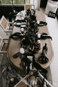 the table is set with black and white decorations