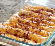 bacon breakfast enchiladas in a casserole dish