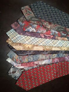 a pile of ties sitting on top of each other