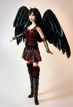 a woman dressed in black and red with wings