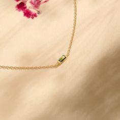 The Baguette Birthstone Bracelet is a stunning, personalized piece that celebrates your unique story. This bracelet showcases a sparkling baguette-cut birthstone that adds both color and meaning. Whether as a gift or a personal treasure, it’s a stylish way to carry a symbol of your birth month or a loved one close. - Made in 14k solid gold - Top Width, 8.64x2.21mm / 0.340x0.087 inches - Chain Thickness: 0.93 mm / 0.037 inches -This product comes with iconic Norm Jewels gift box Elegant Gold Plated Birthstone Bracelets, Minimalist Yellow Gold Bracelet With Birthstone, Gold Plated Birthstone Bracelets Gift, Dainty 14k Gold Birthstone Chain Bracelet, Elegant Gold-plated Birthstone Bracelets, Color And Meaning, Baguette Bracelet, Birthstone Bracelet, Gold Top