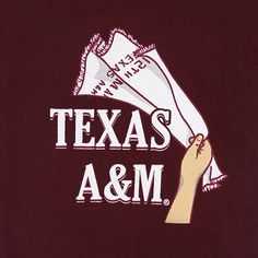 the texas a & m logo is shown on a maroon t - shirt that reads, texas a & m