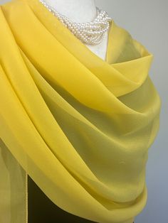 Elevate your style with our exquisite collection of chiffon shawls. Our chiffon shawls are the epitome of elegance and versatility, designed to effortlessly enhance your wardrobe and leave a lasting impression. Made from the fine poly chiffon fabric, these shawls offer a delicate and airy drape that adds a touch of grace to any outfit. Whether you're attending a special occasion, a casual gathering, or simply want to elevate your everyday look, our chiffon shawls are the perfect accessory. Choos Elegant Yellow Dupatta, Elegant Chiffon Dupatta In Traditional Drape, Yellow Chiffon Dupatta For Wedding, Yellow Elegant Dupatta, Elegant Formal Chiffon Dupatta, Chiffon Silk Scarf For Weddings, Elegant Silk Scarves In Traditional Drape, Elegant Georgette Shawl, Elegant Silk Scarves With Traditional Drape