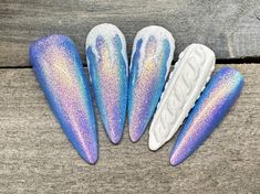 Dawn Witch Designs Unique, re-usable, hand painted, and made in Canada. These luxury press on nails are handmade using high quality gel polish and salon-grade materials.  ✨ FROSTED SEASON ✨  This set has a beautiful blue shimmer with 3D icicles and a 3D sweater nail as an accent. It's the perfect set for the winter season! *The shape shown in the pictures is the MEDIUM ALMOND *Colours may appear a little different due to your personal monitor settings* ✨ BUY 3 GET 1 PROMOTION ✨  ➜ Buy 3 sets of Almond Nail Art Christmas, Extra Winter Nails, Cold Nail Designs, Iridescent Snowflake Nails, Holiday Glass Nails, December Nails Stilleto, Blue Christmas Nails Designs, Blue Winter Nail Designs Short, Blue Sweater Nail Designs