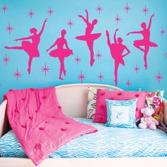 a bedroom decorated in pink and blue with ballet silhouettes on the wall